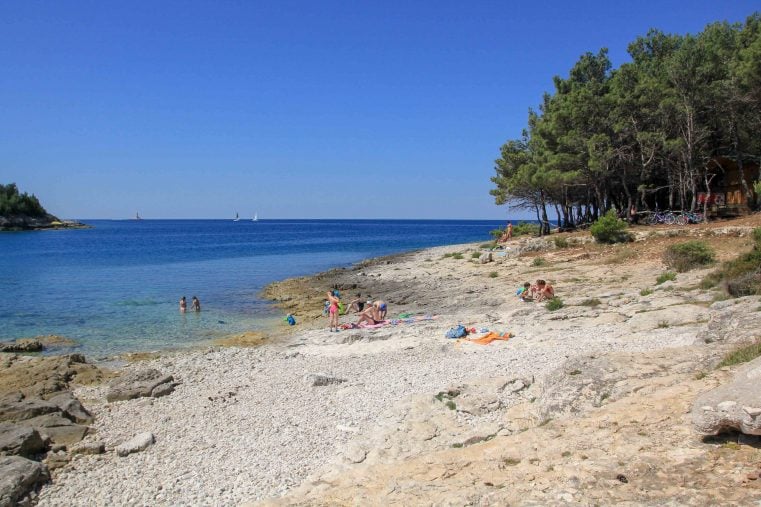 Sunbathers relax on Kamenjak Beach